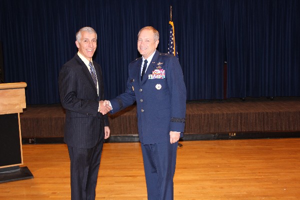 Col. Philip Platt, USAF (Ret.) (l), chapter president, thanks Brig. Gen. Kevin B. Wooton, USAF, director, communications and information, Headquarters Air Force Space Command, for his luncheon presentation in January.